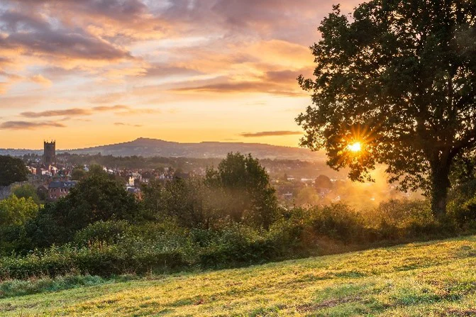 Image Of Sunset Over Rural Countryside In Shropshire And Town In The Distance.